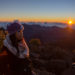 girl posing in front of the Haleakala Crater sunrise